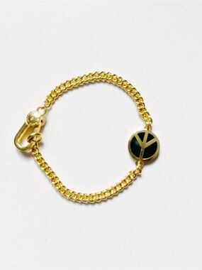 Marc Jacobs Gold Bracelet with Black Peace Sign Charm